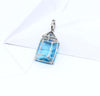 SJ2825 - Blue Topaz and Diamond Pendant Set in 18 Karat White Gold Settings
