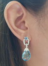 SJ2100 - Blue Topaz with Diamond Earrings Set in 18 Karat White Gold Settings