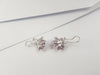 JE0174O - Invisible Set Pink Sapphire & Diamond Lotus Earrings set in 18 Karat White Gold Setting