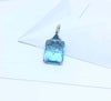 SJ2825 - Blue Topaz and Diamond Pendant Set in 18 Karat White Gold Settings