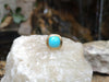 SJ2128 - Turquoise Ring Set in 18 Karat Gold Settings