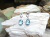 SJ2100 - Blue Topaz with Diamond Earrings Set in 18 Karat White Gold Settings