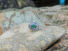 SJ1446 - Emerald with Blue Sapphire and Diamond Ring Set in 18 Karat White Gold Settings