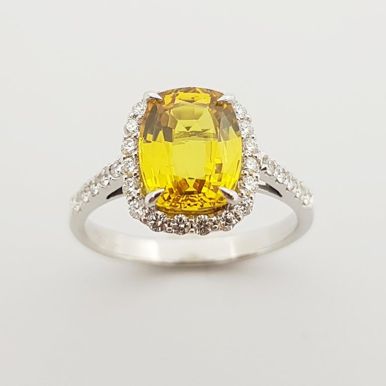 SJ2697 - Cushion Cut Yellow Sapphire with Diamond Halo Ring Set in 18 Karat White Gold