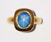 SJ2686 - Blue Star Sapphire Ring Set in 18 Karat Gold Settings