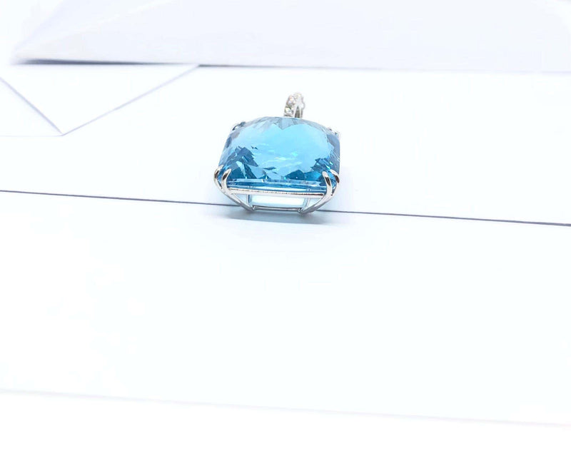 SJ2825 - Blue Topaz and Diamond Pendant Set in 18 Karat White Gold Settings