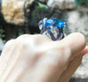 SJ1273 - Blue Topaz with Blue Sapphire and Diamond Ring in 18 Karat White Gold Settings