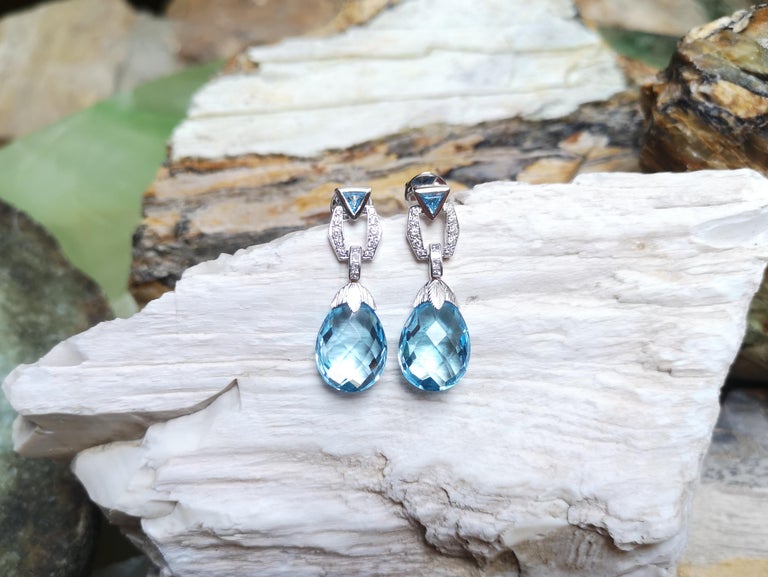 SJ2100 - Blue Topaz with Diamond Earrings Set in 18 Karat White Gold Settings