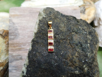 SJ2126 - Ruby with Diamond Pendant Set in 18 Karat Gold Settings