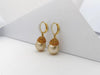 JE0697W - Yellow Sapphire, Diamond and South Sea Pearl Earrings in 18 Karat Gold Setting