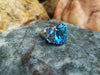 SJ3103 - Blue Topaz Ring Set in 18 Karat White Gold Settings